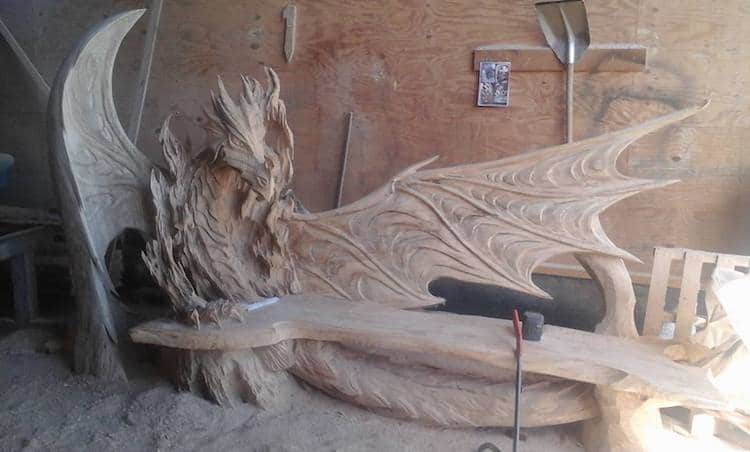 Chainsaw artist carves giant log into incredible dragon bench