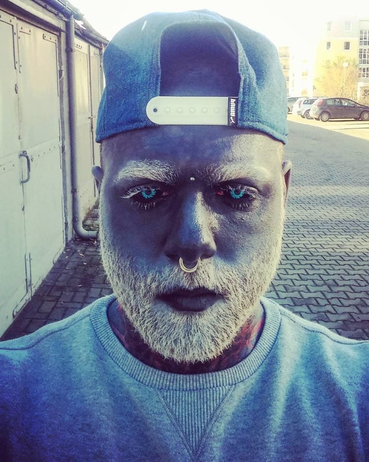 Man Tattoos Entire Face Grey, Dyes Beard White, Ends Up Looking Like a Negative Version of Himself