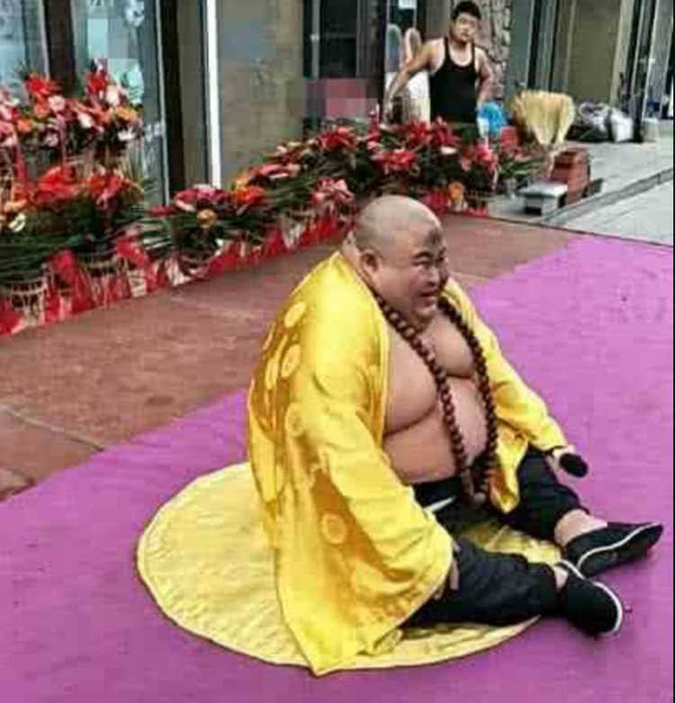Chinese Man Makes a Living Posing as RealLife "Laughing Buddha"