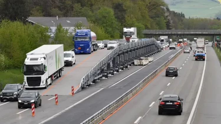 Innovative Mobile Bridge Allows Workers to Pave Roads Without Stopping Traffic